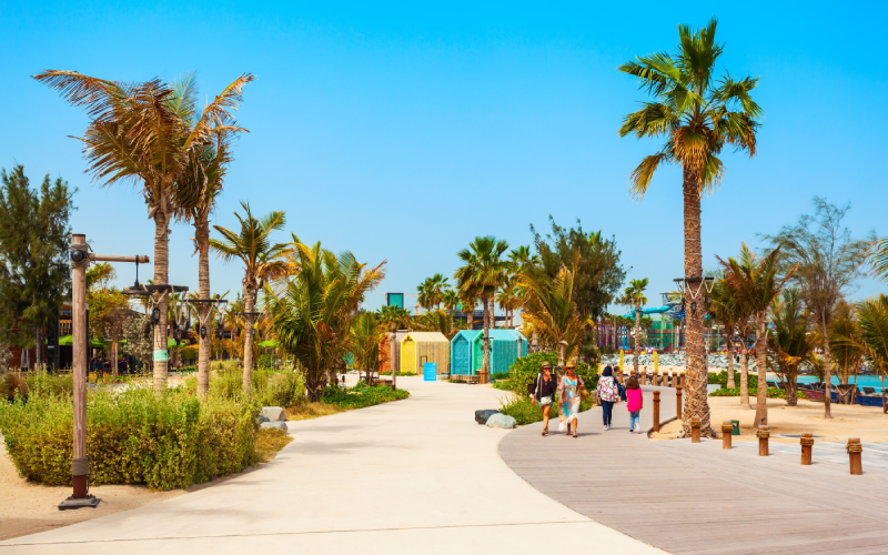 People walking at La Mer Beach Dubai