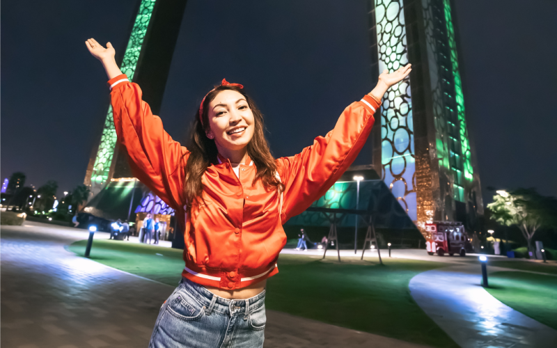 Happy tourist at glowing Dubai Frame