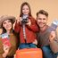 Happy family with passports and luggage ready for travel