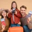 Happy family with passports and luggage ready for travel