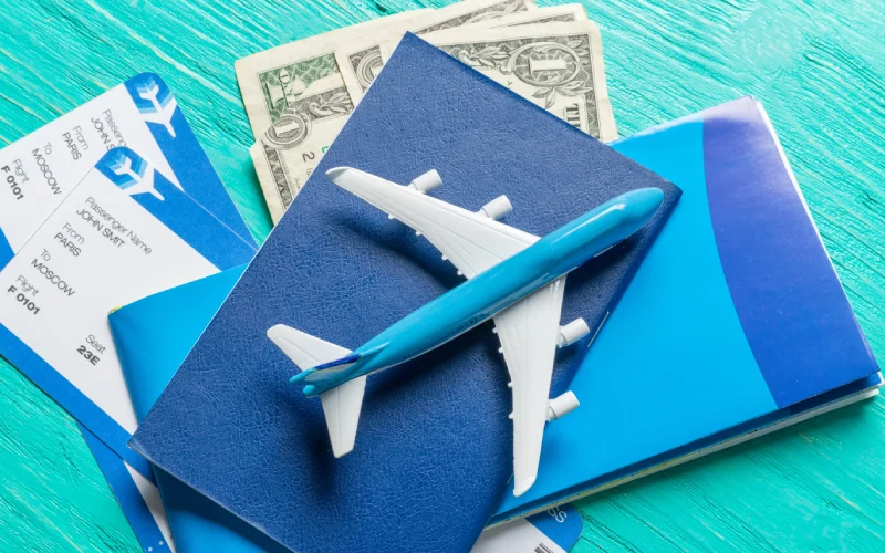 Airplane model, passports, tickets, and money